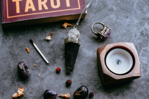 Picture of crystals, candles and tarot cards used by Wiccans