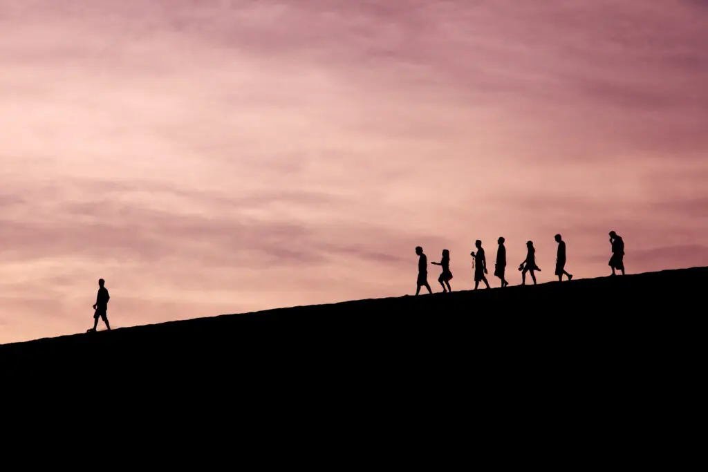 What is a gospel advancing leader shown by a group of people walking behind another person