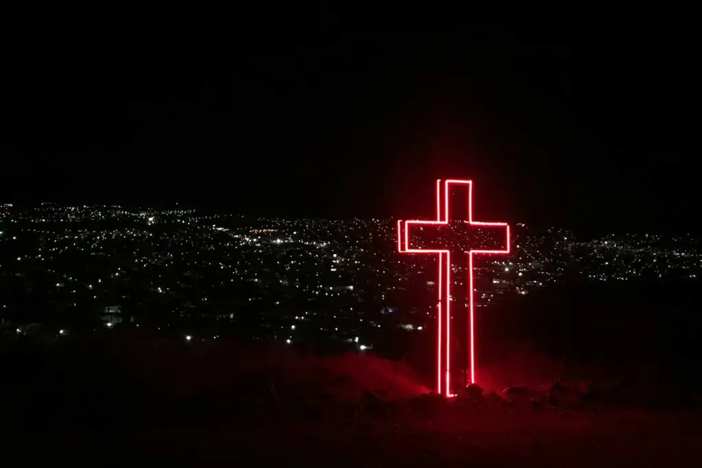 Gender, sexuality, and the Gospel reaching the culture shown by a red cross in the night.
