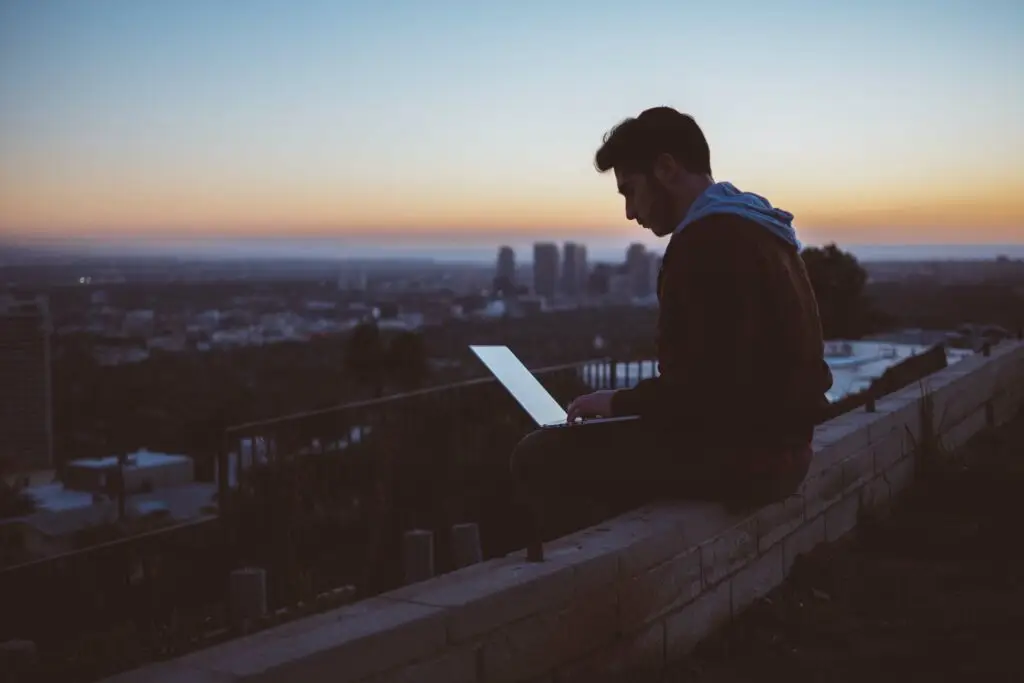 A man working on a rooftop, representing the Bivocational youth pastor who needs help