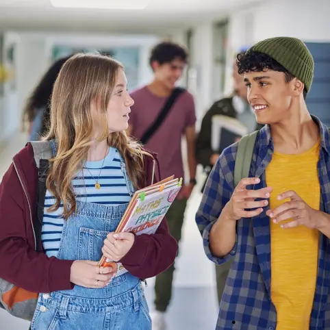 teens talking representing that youth ministry should track gospel conversations.